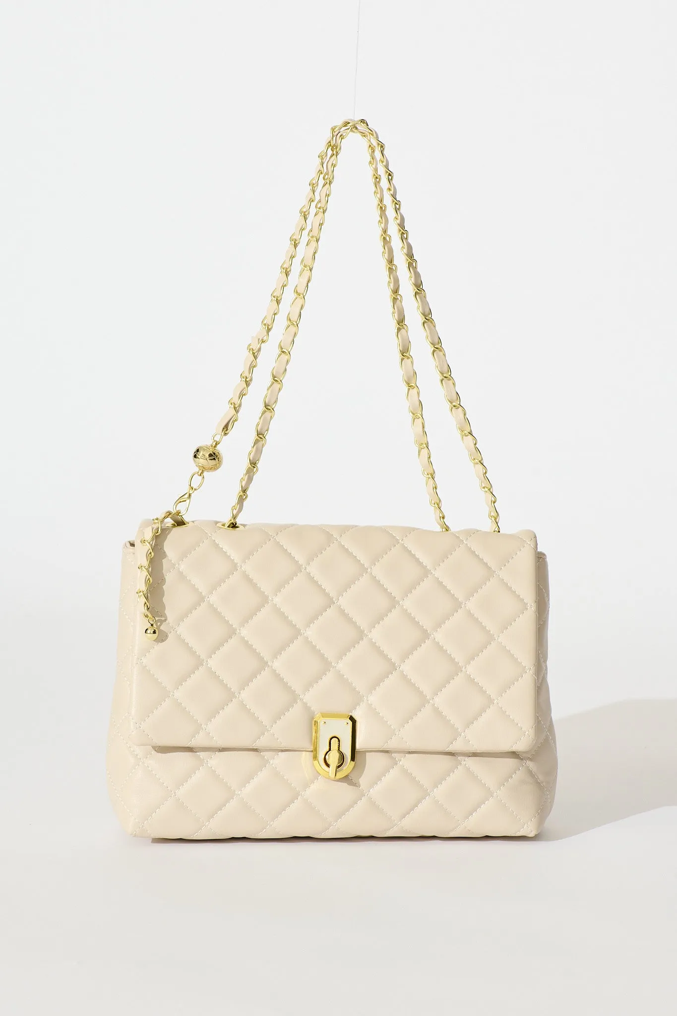 Eliza Quilted Crossbody Bag In Beige