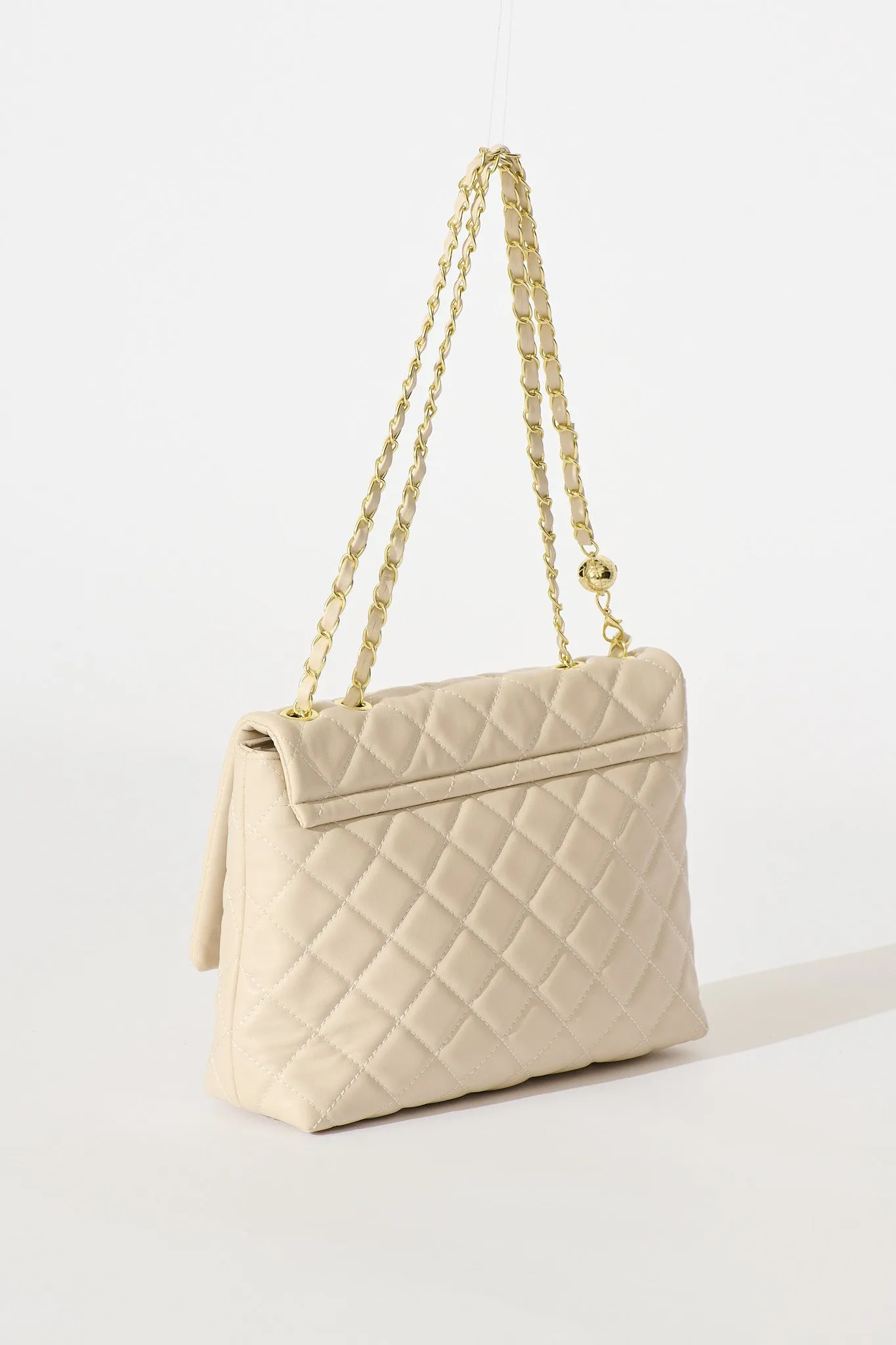 Eliza Quilted Crossbody Bag In Beige