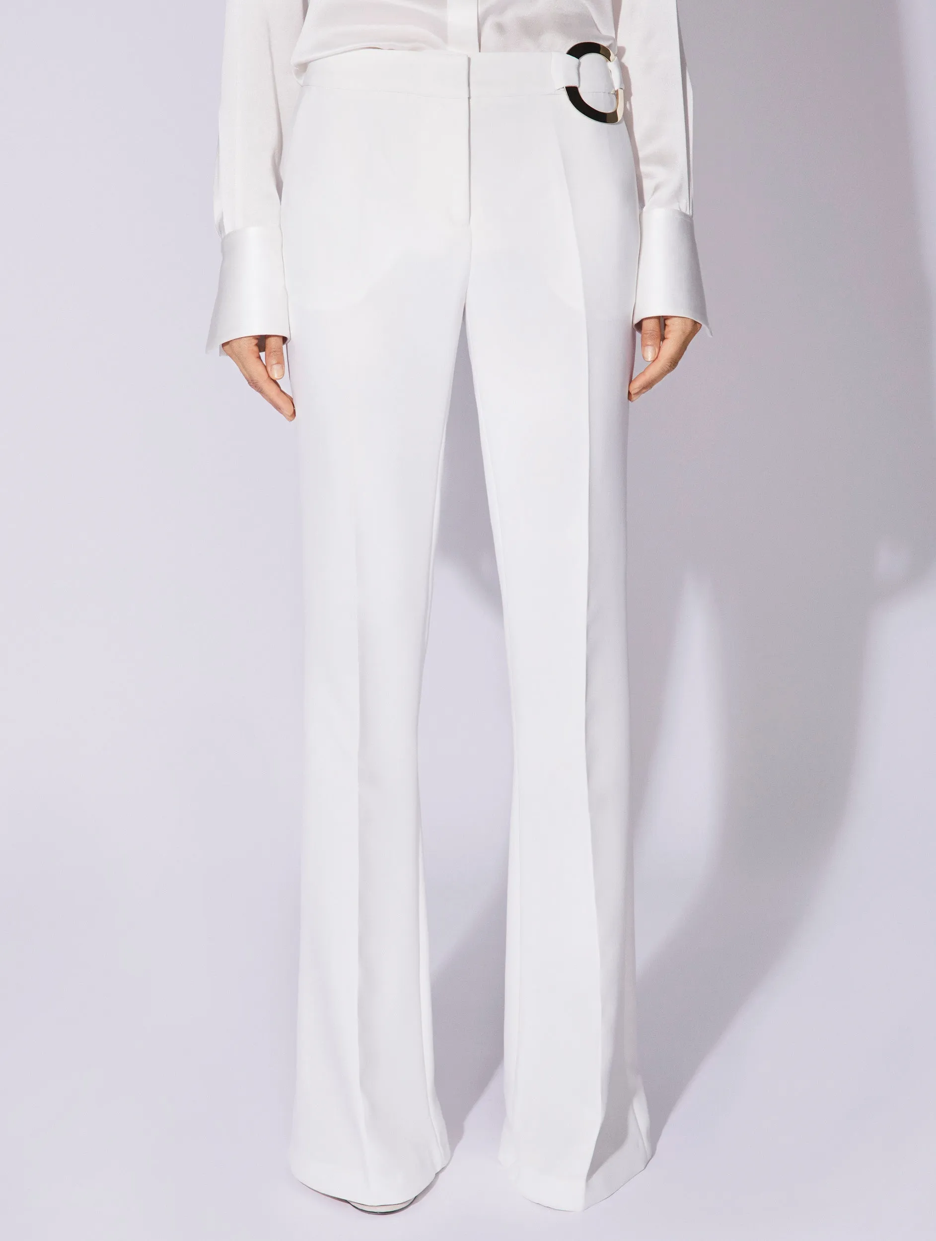 White crepe flared trousers with buckle